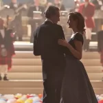 Two people dance with balloons on the floor in the film Phantom Thread