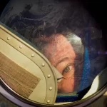 Cady Coleman looking out of the Soyuz in the film Space: The Longest Goodbye