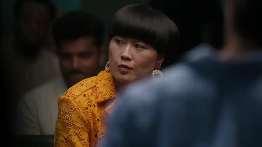 A woman with a black bob haircut looks to her right in the movie Group Therapy, one of the 15 films to watch at the Tribeca Film Festival according to Loud and Clear Reviews